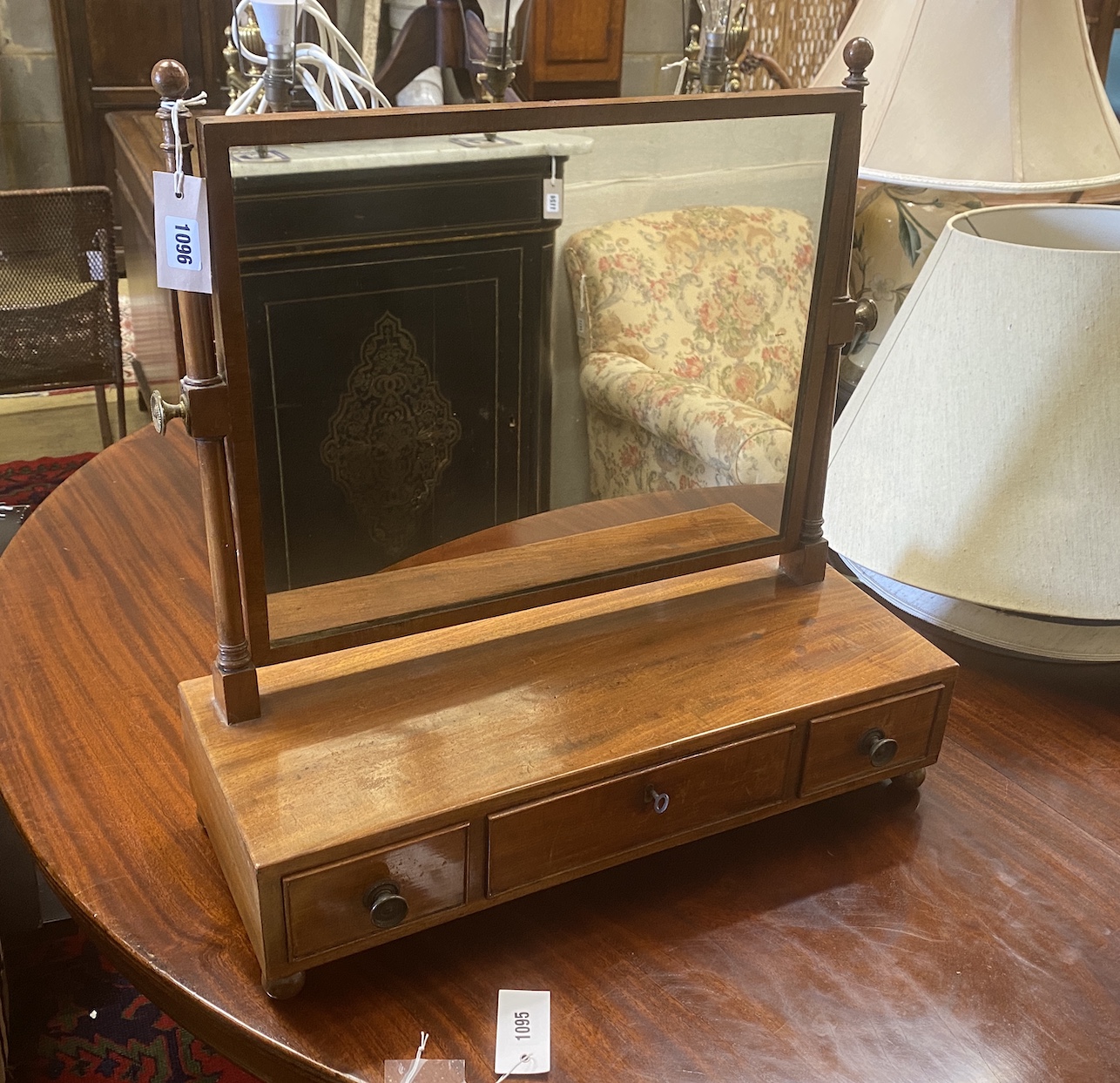 A Regency mahogany three drawer box base toilet mirror, width 57cm, depth 22cm, height 58cm